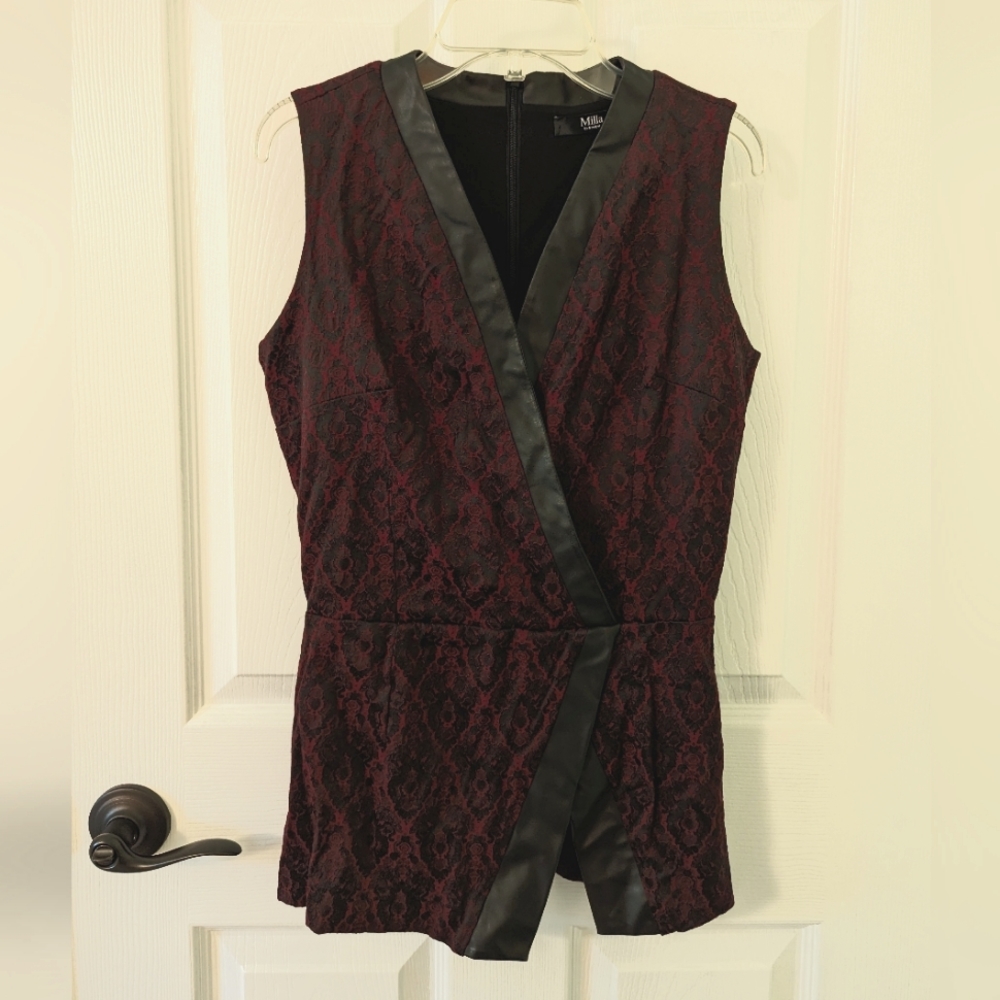 Faux wrap peplum top with patent leather trim